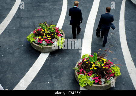 business men walk through Vancouver, BC. Stock Photo
