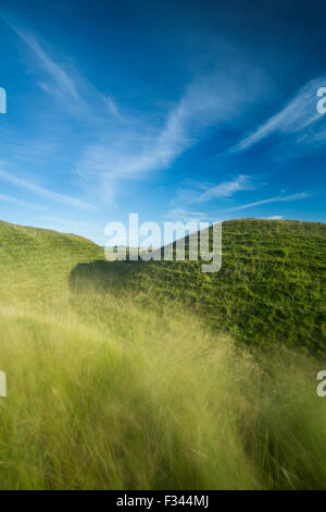the western ramparts of Maiden Castle, an Iron Age hill fort near Dorchester, Dorset, England, UK Stock Photo