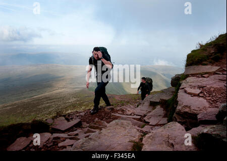 Brecon Beacons, UK. 29th September, 2015. Walkers enjoyed the early morning autumn sun, as they climbed up to admire clear panoramic views. Pen Y Fan is the highest mountain in south Wales and indeed the southern part of the United Kingdom. Credit:  roger tiley/Alamy Live News Stock Photo