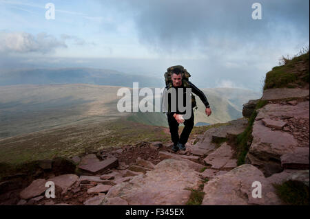 Brecon Beacons, UK. 29th September, 2015. Walkers enjoyed the early morning autumn sun, as they climbed up to admire clear panoramic views. Pen Y Fan is the highest mountain in south Wales and indeed the southern part of the United Kingdom. Credit:  roger tiley/Alamy Live News Stock Photo