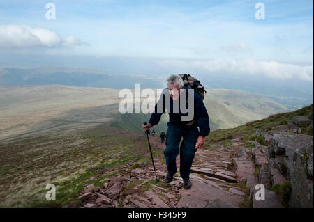 Brecon Beacons, UK. 29th September, 2015. Walkers enjoyed the early morning autumn sun, as they climbed up to admire clear panoramic views. Pen Y Fan is the highest mountain in south Wales and indeed the southern part of the United Kingdom. Credit:  roger tiley/Alamy Live News Stock Photo