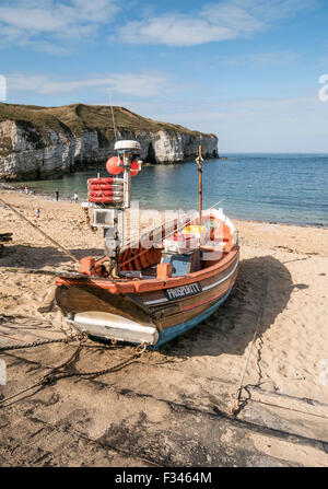 Fishing Coble on Beach at North Landing Flamborough Yorkshire UK Stock Photo