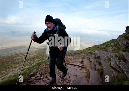 Brecon Beacons, UK. 29th September, 2015. Walkers enjoyed the early morning autumn sun, as they climbed up to admire clear panoramic views. Pen Y Fan is the highest mountain in south Wales and indeed the southern part of the United Kingdom. Credit:  roger tiley/Alamy Live News Stock Photo