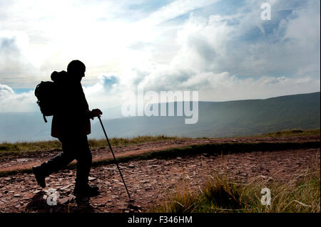 Brecon Beacons, UK. 29th September, 2015. Walkers enjoyed the early morning autumn sun, as they climbed up to admire clear panoramic views. Pen Y Fan is the highest mountain in south Wales and indeed the southern part of the United Kingdom. Credit:  roger tiley/Alamy Live News Stock Photo