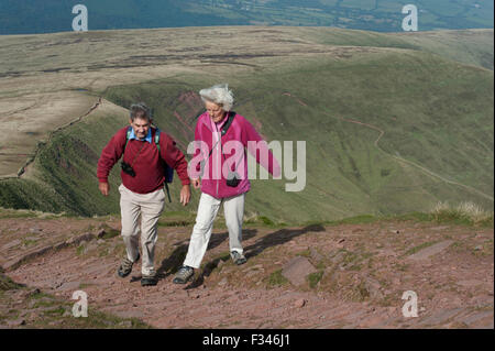 Brecon Beacons, UK. 29th September, 2015. Walkers enjoyed the early morning autumn sun, as they climbed up to admire clear panoramic views. Pen Y Fan is the highest mountain in south Wales and indeed the southern part of the United Kingdom. Credit:  roger tiley/Alamy Live News Stock Photo