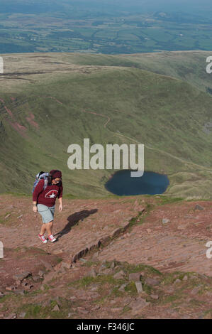 Brecon Beacons, UK. 29th September, 2015. Walkers enjoyed the early morning autumn sun, as they climbed up to admire clear panoramic views. Pen Y Fan is the highest mountain in south Wales and indeed the southern part of the United Kingdom. Credit:  roger tiley/Alamy Live News Stock Photo