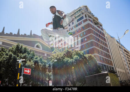 Athletic man doing parkour in the city Stock Photo