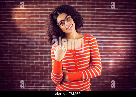 Smiling attractive woman playing with hair Stock Photo