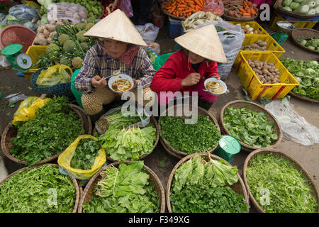 women eating noodles in Dong Ba Market, Hue, Vietnam Stock Photo