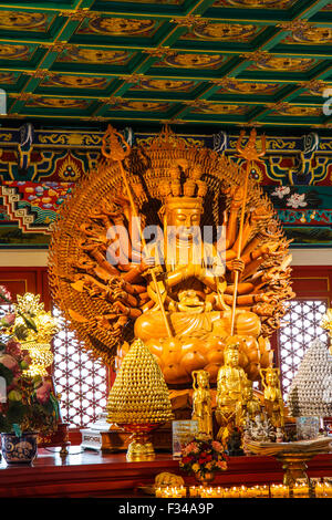 Wooden Guan Yin sculpture, holy chinese goddess in Chinese temple Bangkok Thailand Stock Photo