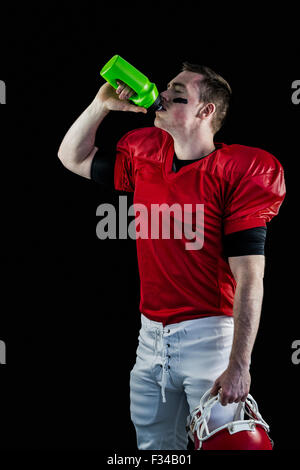 American football player drinking Stock Photo