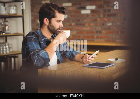Young student using his smartphone Stock Photo