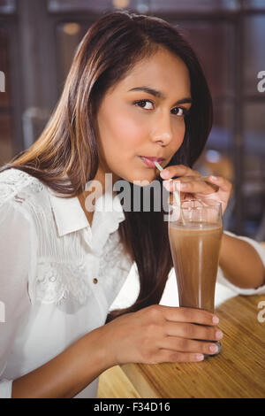 Portrait of a beautiful woman drinking a hot chocolate Stock Photo