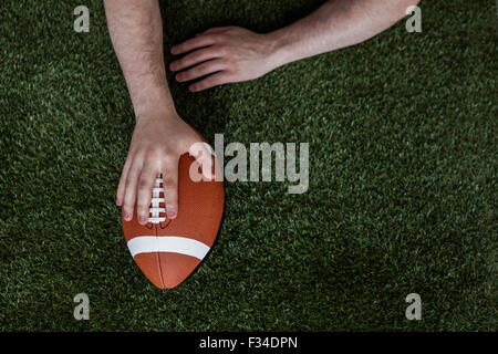 American football player scoring a touchdown Stock Photo
