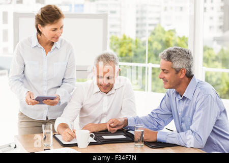 Smiling business people making an arrangement Stock Photo