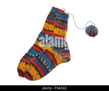 A pair of bright knitted striped socks and a ball of yarn isolated on white Stock Photo