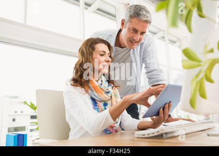 Two casual designers working with tablet Stock Photo