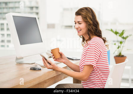 Casual businesswoman using smartphone Stock Photo
