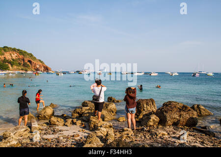 tourists playing at Beach, in Ko Lan ( Larn Island ) in Pattaya, Thailand Stock Photo