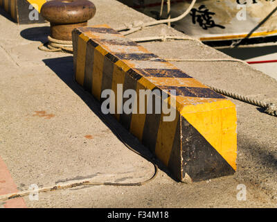 Yellow road barriers blocking on the road Stock Photo