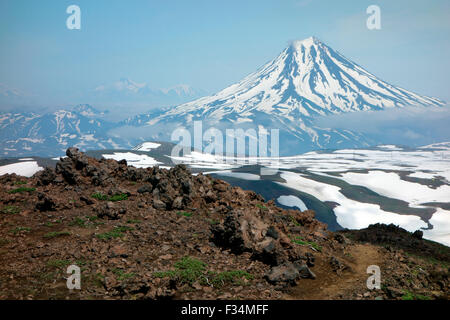Beautiful volcanic landscape of Vilyuchinsky volcano from the slopes of Gorely Volcano , Kamchatka Peninsula, Russia Stock Photo