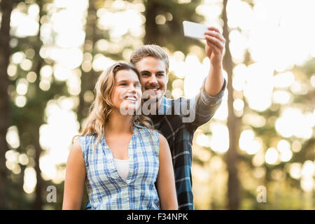 Happy smiling couple embracing and taking selfies Stock Photo