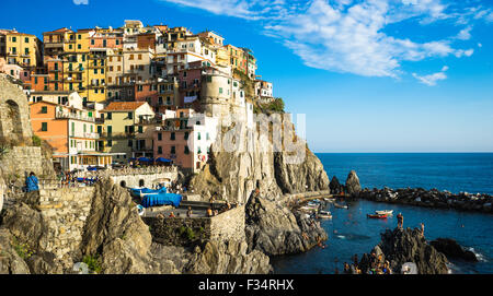 Cliffside view of Manarola village and harbor in Italy's Cinque Terre. Stock Photo