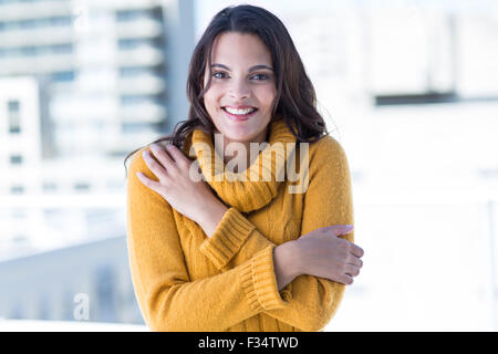 Happy woman feeling cold Stock Photo