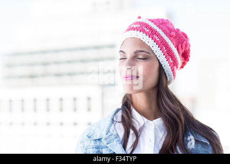 Pretty brunette feeling the air with eyes closed Stock Photo - Alamy