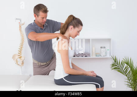 Doctor doing neck adjustment Stock Photo