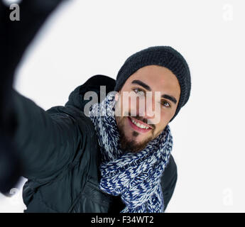 Bearded man using a selfie stick Stock Photo