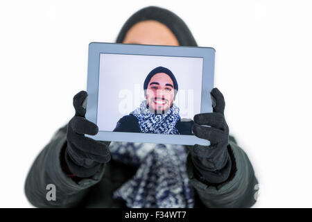 Bearded man using a tablet to take a selfie Stock Photo