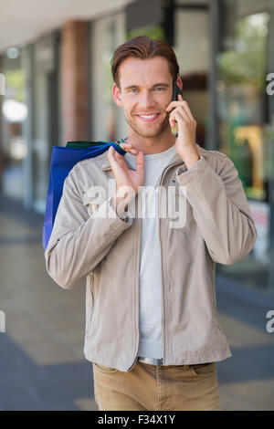 Portrait of a smiling man calling Stock Photo