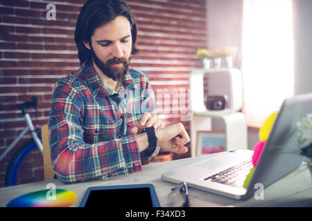 Businessman checking time Stock Photo