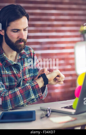 Smart businessman checking time Stock Photo