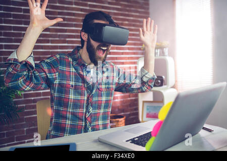 Surprised creative businessman wearing 3D video glasses Stock Photo