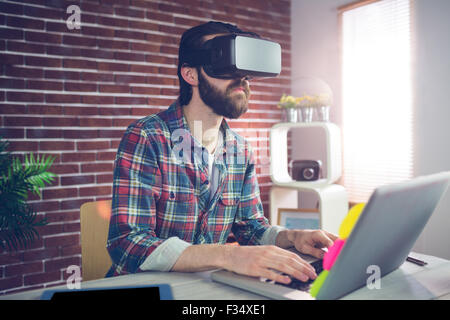 Serious businessman wearing 3D video glasses Stock Photo
