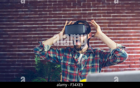 Shocked editor using 3D video glasses Stock Photo