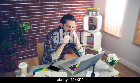 High angle view of businessman yawning at office Stock Photo