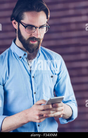 Serious man using smartphone Stock Photo
