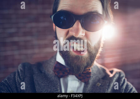 Portrait of angry fashionable man wearing sunglasses Stock Photo