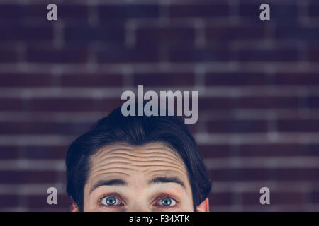Portrait of man with raised eyebrows Stock Photo