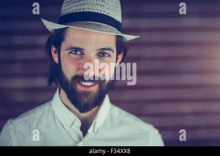 Portrait of smiling hipster wearing hat Stock Photo