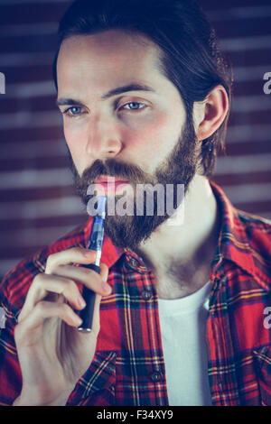Man with electronic cigarette looking away Stock Photo