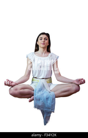 Girl in white dress floating in air Stock Photo