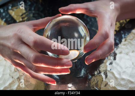 Fortune teller using crystal ball Stock Photo