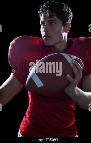 Confident American football player playing Stock Photo