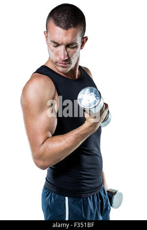 Athlete working out with dumbbells Stock Photo - Alamy