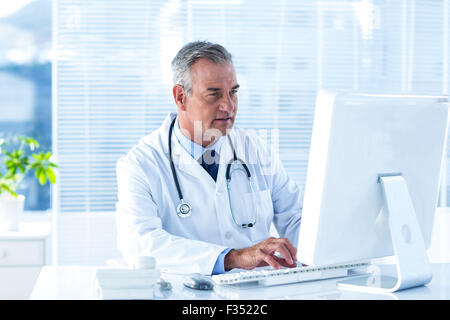 Male doctor using computer in hospital Stock Photo