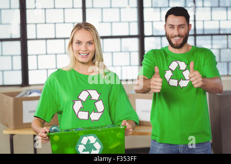 Portrait of woman holding container Stock Photo